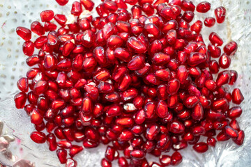 pomegranate seeds on white background