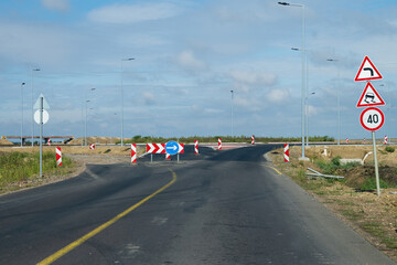 Fototapeta premium Road Under Construction with Traffic Signs 