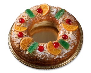 Roscón de Reyes with candied fruits presented on a decorative golden plate or tray, isolated on a transparent background. A typical Spanish dessert for Three Kings Day or Epiphany