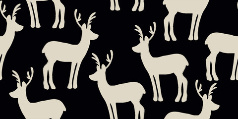 Seamless pattern of decorative reindeer. Hand drawn holiday symbol, deer silhouette.
