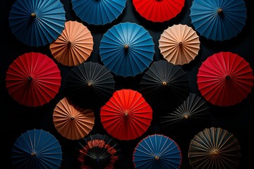 Naklejka premium Stunning array of colorful open umbrellas contrasting beautifully against a deep black background