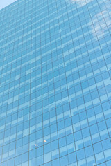 Obraz premium Glass building window. Architectural detail. Background of architecture. Modern glass background. Glass facade background. Architecture. Building facade storey architecture. Building background