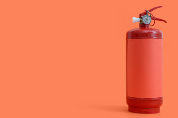 Fire extinguisher on orange background