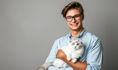A smiling young man holding a fluffy white Ragdoll cat, capturing a heartwarming moment of companionship and affection between the two, with the cat’s striking blue eyes and soft fur adding to the cha