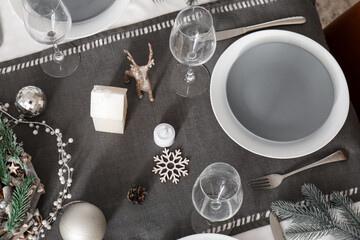 Dining table served for Christmas celebration, closeup