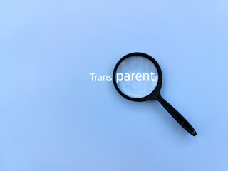 Magnifying glass with transparent text. Business transparency and accountability concept