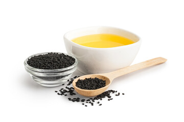 Bowl of oil and wooden spoon with sesame seeds on white background
