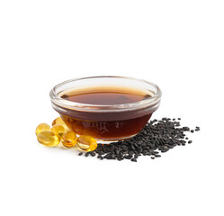 Bowl of oil with capsules and sesame seeds on white background