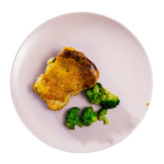Appetizing fried chicken pieces served on plate with broccoli. Isolated over white background