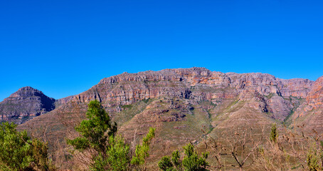 Outdoor, freedom and view of mountain, holiday location and peace in sustainable landscape. Earth, countryside and hills to explore on vacation, remote adventure and wild environment for travel