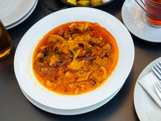 Appetizing beef tripe served with sauce in bowl