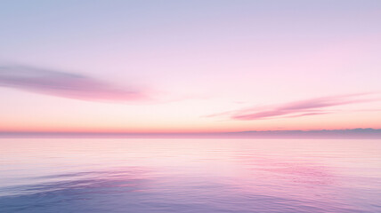 Obraz premium A soft, minimalistic sunset gradient with shades of pink, purple, and soft blue blending seamlessly into a cloudy background