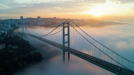 Obraz premium A stunningly modern bridge connecting two cities, surrounded by morning fog, creating a dramatic and serene scene
