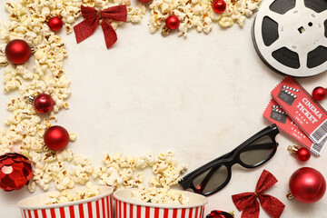 Composition with 3D glasses, bucket of popcorn, cinema tickets, film reel and Christmas decorations...