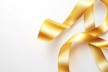 A single gold ribbon laid out flat against a pure white surface