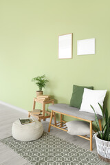 Interior of room with soft bench, stool and pouf