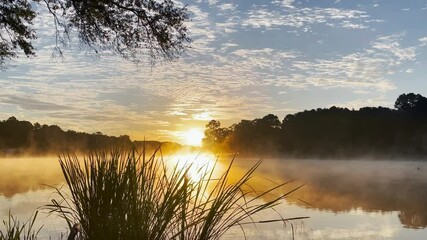 A majestic sunrise over a steamy lake in Texas. - Powered by Adobe