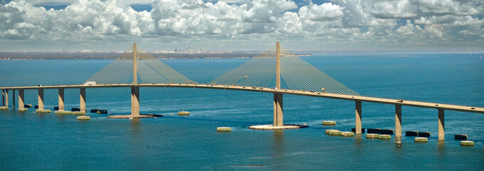 Aerial view of Sunshine Skyway Bridge over Tampa Bay in Florida with moving traffic. Concept of...