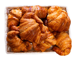 Delicious hot croissants on the breakfast table. Isolated over white background