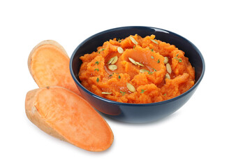 Tasty mashed sweet potato with pumpkin seeds in bowl and cut vegetables isolated on white