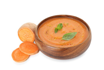 Delicious sweet potato soup with spices in bowl and cut vegetable isolated on white