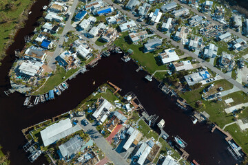 Badly damaged mobile homes after hurricane Ian in Florida residential area. Consequences of natural...