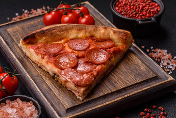 Pepperoni pizza with sausage, mozzarella cheese, tomatoes, salt and spices