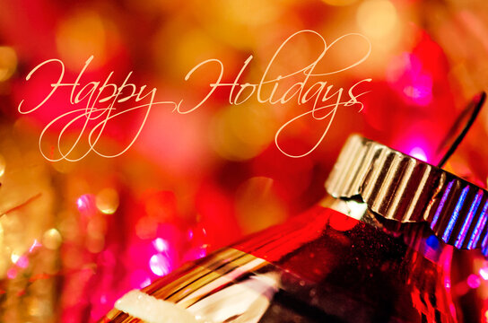 Christmas ornament on red and gold with Happy Holidays message