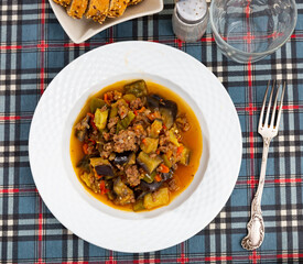 Appetizing vegetable stew with minced meat served on plate