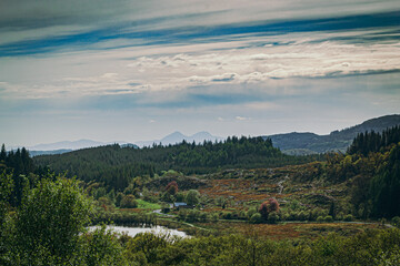 Looking across Loch Barnluasgan at the Scottish Beaver Trail,  towards the Isle of Jura, with the Paps of Jura mountains visible