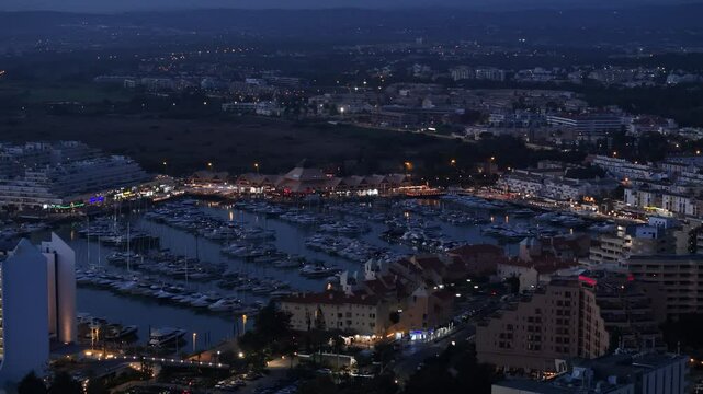 Aerial perspective of Vilamoura marina at night in Algarve, Portugal