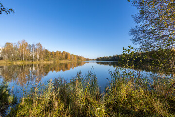 A lake with a blue sky in the background