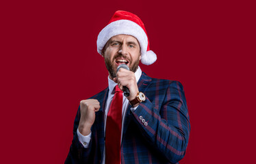 glad event host man singing at christmas isolated on red. christmas event host man singing.