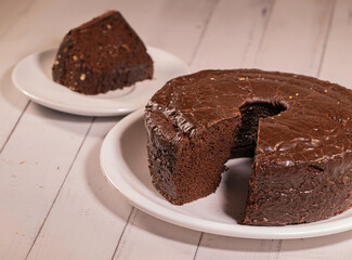 Brazilian Chocolate Covered Cake with Slice on Separate Plate