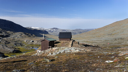 Mountain pass in Tjäktja valley with emergency shelter placed in nordic nature offers great view...