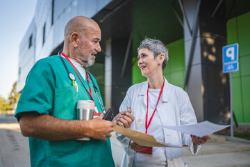 Healthcare professionals colleagues read documents from envelope