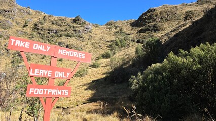 A sign for tourists that states 