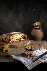 Sliced ​​homemade berry pie on wooden table