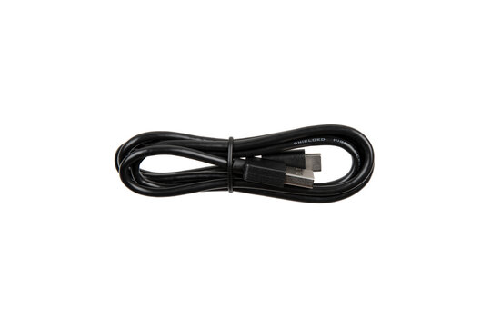 Black USB cable with two connectors, neatly coiled and secured with a strap, isolated on a white background.