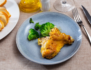 Delicious fried chicken served with broccoli on platter