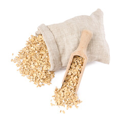 Dry oat flakes, overturned burlap sack and wooden scoop isolated on white, top view