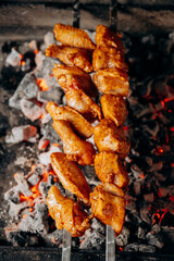 Juicy marinated chicken wings grilled over hot charcoal for the ultimate barbecue experience
