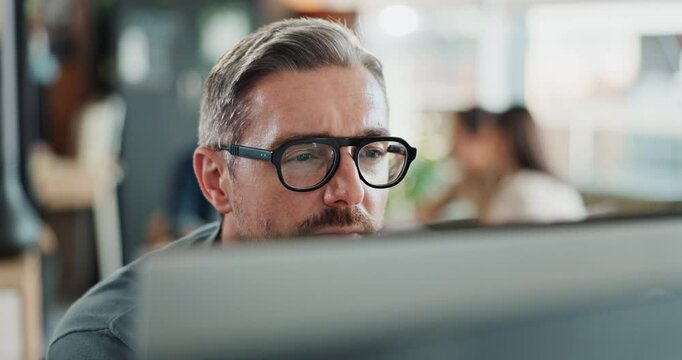 Computer, glasses and thinking with business man in office for administration, report or research. Desktop, programming and reading with mature employee in creative workplace for web development
