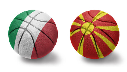 basketball balls with the national flags of macedonia and italy on the white background.