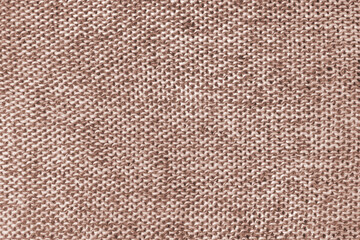 Mixed white and brown color melange knitted fabric, cashmere wool cloth texture. Background of knit fabric, jersey textile structure, cloth surface, weaving of knitwear material.