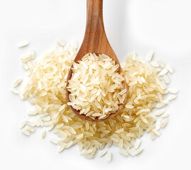 raw rice in wooden spoon