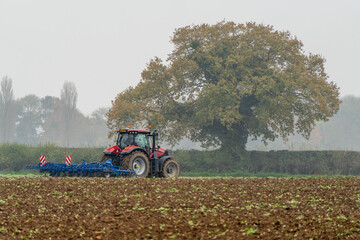 Tractor Ploughing a Field in Autumn