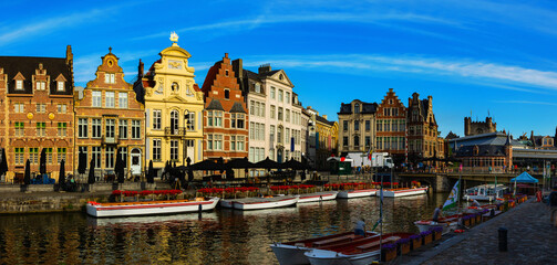 View of Graslei quay and Leie river in historic city center in Ghent, Belgium