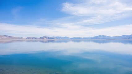 Scenic view of mountains reflected on Pangong Lake with blue sky background in Leh, Ladakh, India, tranquil, Leh, Ladakh