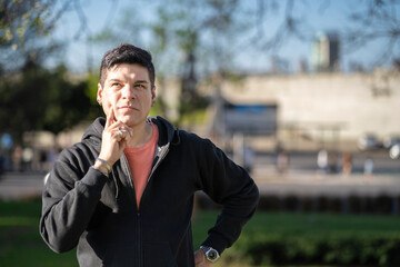 Man with doubtful expression thinking to make a decision